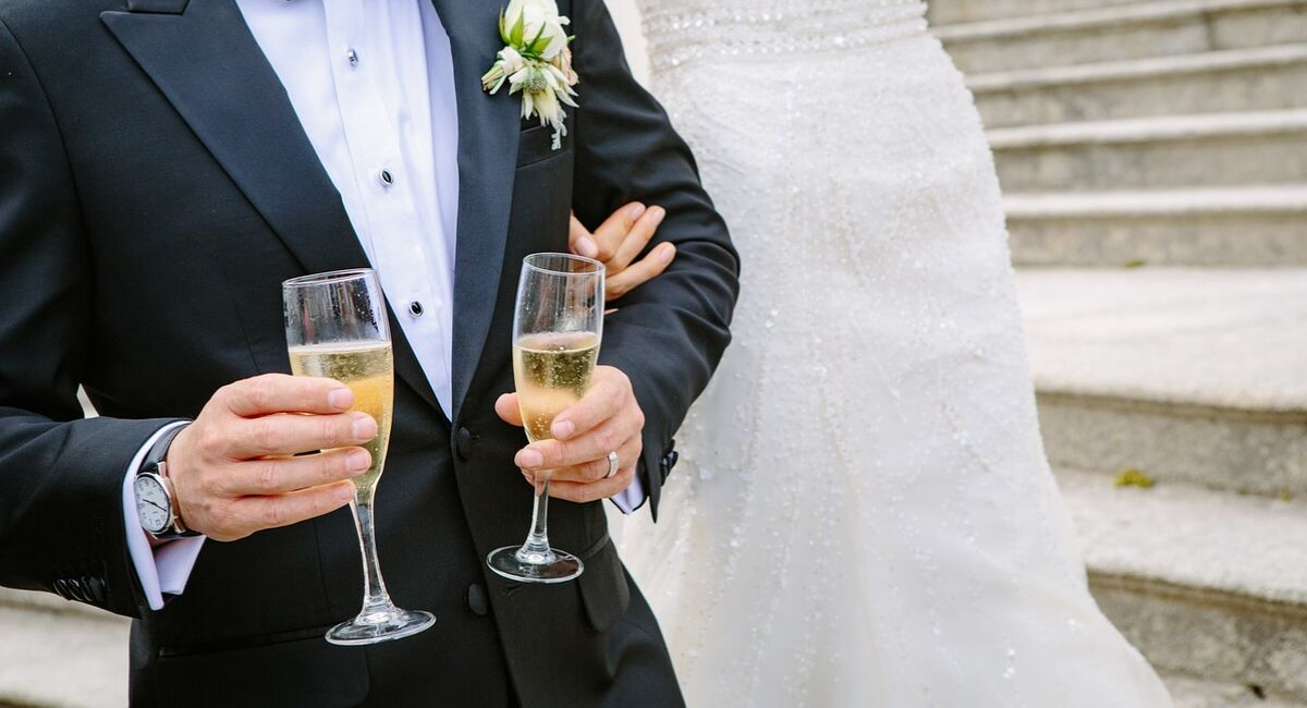 Wedding Loans | bride and groom sharing their first drink together