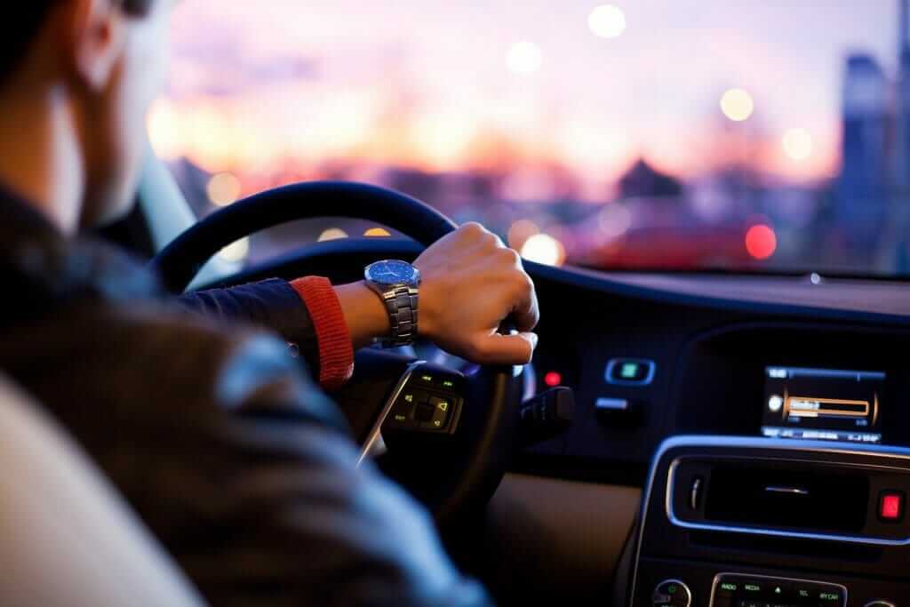 a man driving an expensive car after spending cash quickly