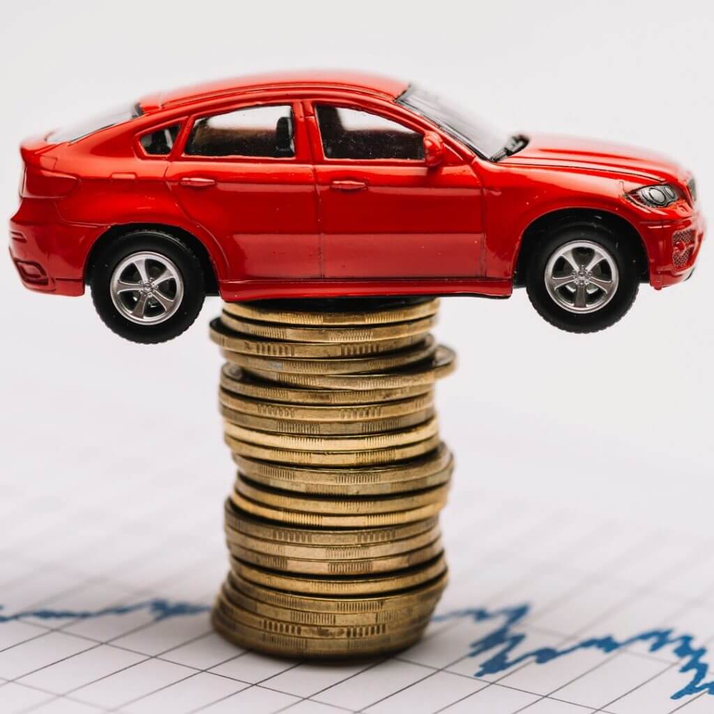 buying a car - car on stack of coins